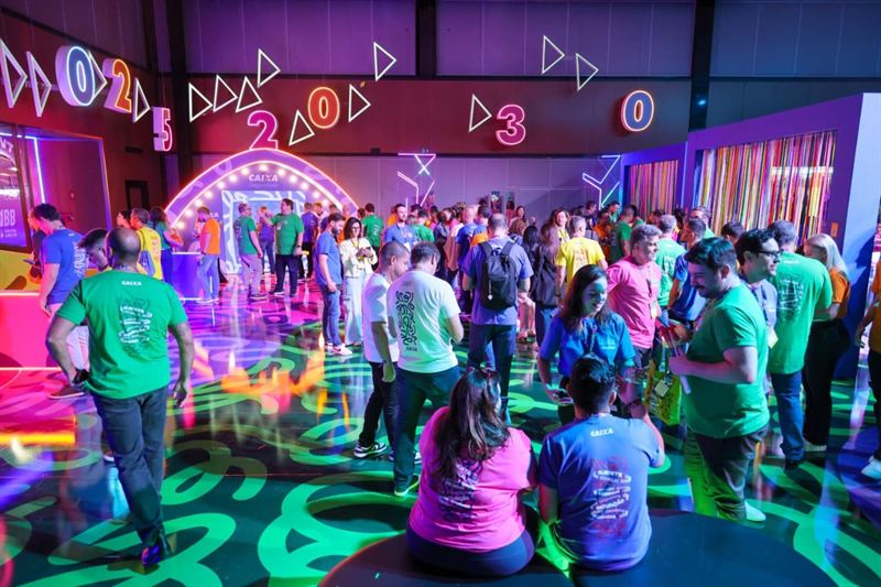 Crowd in the immersive hall with neon numbers